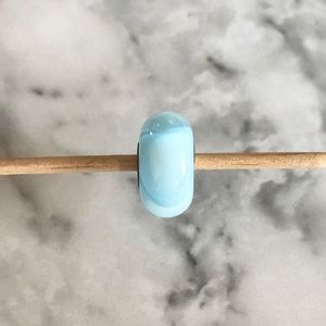 Light blue glass armadillo charm